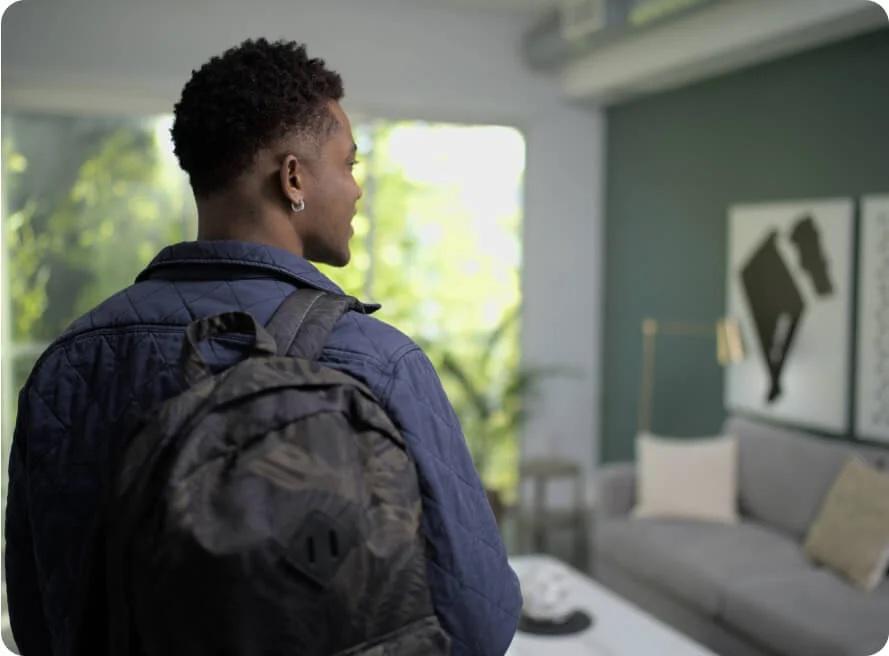 man with backpack flying standby